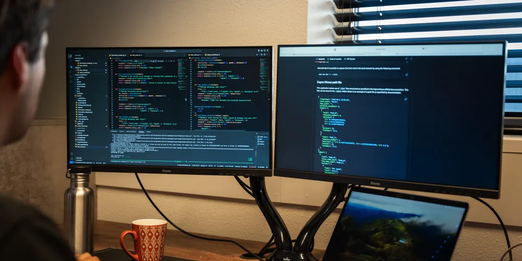 Computer screens showing code